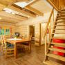 Kitchen-living room with staircase to the sleeping bunk, © Andreas Gruber